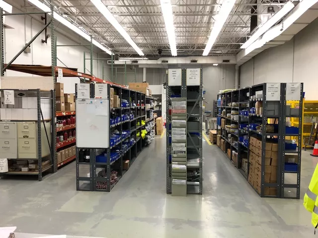 aisles of parts and supplies in a warehouse