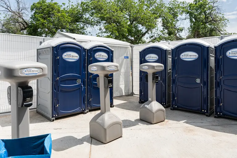 ROS porta potties and handwash stations at an outdoor event