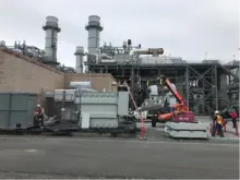 construction equipment and generators outside of power plant