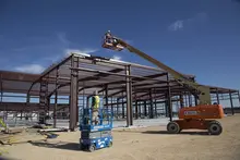 Worker inside lift at jobsite